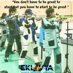 This image captures the essence of our training philosophy: you have to start to be great. Here, young athletes in full gear practice their stance and aim, taking the first steps on their competitive shooting journey.