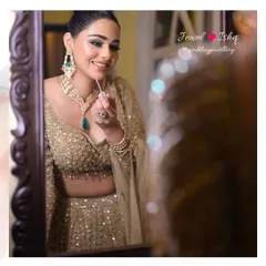 A candid moment of reflection. The bride-to-be admires her look, complete with our emerald-accented Moissanite Polki set. I always ensure my brides have a moment to themselves to truly appreciate how beautiful they look and feel.