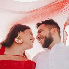 A close-up shot from the same series, focusing on the couple's joyful expressions as they look at each other. This intimate framing captures the genuine connection and happiness shared between them.