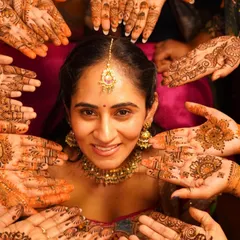 A classic mehendi shot. This close-up highlights the bride's beautiful henna and the delicate maangtikka and jewelry we chose to complement her traditional red outfit.