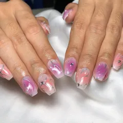 A dreamy, abstract design with a pink and purple "aura" base, overlaid with fine silver swirls and a single rhinestone.
