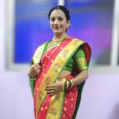 A full-length view of the beautiful Paithani saree. The drape is clean and the pleats are uniform, creating a look of timeless elegance for any special occasion.