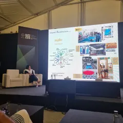 Presenting my work and philosophy at the Young Architects Festival. The presentation slide shows the MapBee framework, which connects diverse fields like policy, art, and design to spark small but impactful changes in our cities.