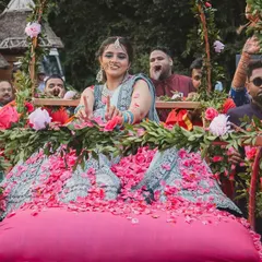 A shower of petals for the beautiful bride during her palanquin entry. We love coordinating these details with the guests to make the bride's entrance even more special and picturesque.