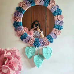 Why shouldn't functional items be beautiful? We handcrafted this macrame mirror with a love for pastels and boho design, creating a one-of-a-kind piece that is both a useful mirror and a stunning piece of wall art.