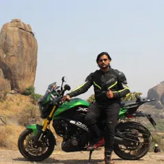 Posing with "Lucky," our green Dominar 400, against the iconic rocky backdrop of Ramanagara. This spot is one of our favorite local destinations for a bit of off-road fun.