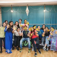 Another fantastic group picture from our Holi party, showcasing the vibrant and inclusive atmosphere at our studio.