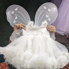 This white baby frock with butterfly wings is perfect for a first birthday or a fairy-themed photoshoot. The top part is made of soft cotton to ensure your little angel is comfortable all day.