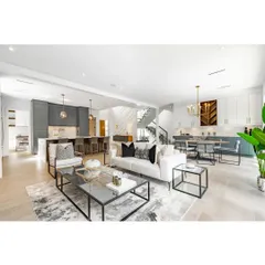 An example of an open-plan layout in a fully renovated apartment. The living, dining, and kitchen areas are distinct yet connected, creating a spacious and sociable environment perfect for modern family life.