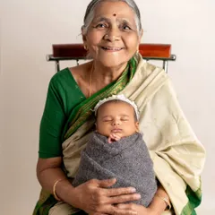 The pride and joy in a great-grandmother's smile says it all. It is an honor to document the connection between generations, preserving the family legacy with the newest member.