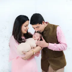 Welcoming a newborn is a chapter filled with overwhelming love. I focus on capturing that tender connection, like a father's gentle kiss, in a comfortable and relaxed at-home session.