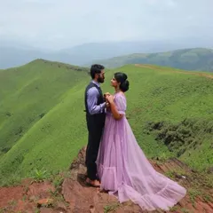 Our lavender gown with puff sleeves is perfect for a dreamy pre-wedding shoot in the mountains. The color stands out against the green hills.