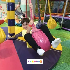 Another happy adventurer enjoying our colorful swings. It's a favorite for many of our visitors.