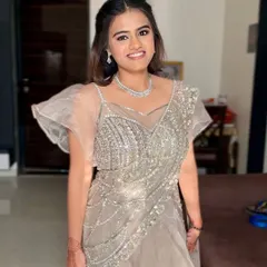 A full-length view of this ethereal silver-grey outfit, where the soft glam makeup adds a touch of radiance.