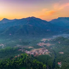 An aerial view of the town of Hornadu nestled in the Western Ghats at sunset. This was from a trip focused on serene immersion in nature, a contrast to my usual whirlwind road trips.