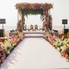 Imagine saying 'I do' with the ocean as your witness. I design breathtaking beachside ceremonies, like this one in Goa, complete with a lush floral mandap and an elegant aisle, ensuring your seaside wedding is as serene and beautiful as the setting itself.