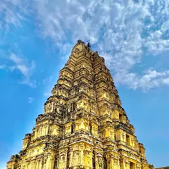 The towering gopuram of the Virupaksha Temple against a brilliant blue sky. This is one of India's oldest functioning temples, and its energy is something you have to experience firsthand.
