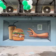 A closer view of the food and hand elements of the 3D cafe mural. The goal was to make the burger look so real you could almost grab it, creating a playful and appetizing visual.