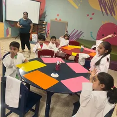 The children are actively participating in a discussion during science camp. We encourage them to ask questions and share their ideas.