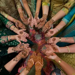 A beautiful group shot of the groom's side, all showing off their festive mehendi. It's always fun to get the whole family ready for the celebrations.