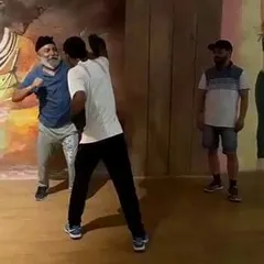 An elderly participant learns to throw a punch at our fitness camp. It's proof that it's never too late to start learning how to defend yourself.