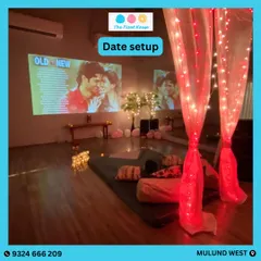 Surprise your loved one with a private date night. We offer custom setups like this cozy movie night with a projector, comfy seating, and romantic lighting in one of our private studios.