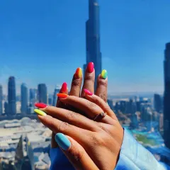 My client sent me this amazing holiday photo from Dubai. Her vibrant ombré summer nails look stunning against the Burj Khalifa.