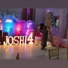 The planner posing with the grand princess party setup, showcasing the scale of the event we organized.