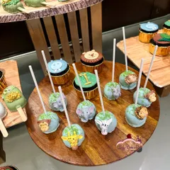 Cake pops are always a hit with kids and adults. For this jungle party, I created these adorable animal-themed cake pops, each featuring a different friendly face like a giraffe, elephant, or lion.
