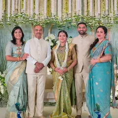 A beautiful family portrait. I had the pleasure of designing blouses for the mom-to-be and her sister, ensuring they both looked radiant for the baby shower.