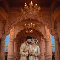 I used the intricate arches and warm chandeliers of the palace to frame this intimate couple's portrait. The lighting creates a soft, romantic glow, highlighting the elegance of their traditional attire.