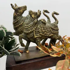 Another angle of the twin Nandi sculpture, showing its solid form and the beautiful patina of the brass.