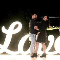 A modern, chic look for the couple's evening shoot. I switched to a simple black dress and created a soft glam makeup look with loose hair, showing versatility for different themes.