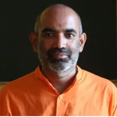 A portrait of Swami Tattvarupananda, a respected teacher who offers online classes on texts like the Hatha Yoga Pradipika and the Bhagavad Gita through our associated Gurukulam.