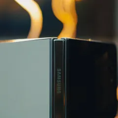 This abstract product shot of the Samsung Galaxy Z Flip 5 uses creative lighting to emphasize the phone's unique hinge design and premium build quality, offering a more artistic take on tech photography.