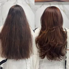The back view of this transformation showcases the health and bounce of her new style. The layers are cut to create movement, making the hair look fuller and more dynamic.