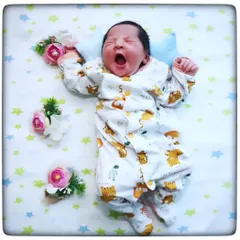 That perfect, tiny yawn. These are the fleeting moments I love to capture, freezing a memory that feels like it happened just yesterday.