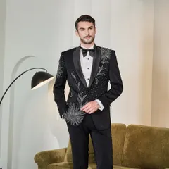 This ceremonial black tuxedo features stunning hand-embroidery in a firework-like pattern, designed for the man who embraces sartorial style. It's a piece that balances classic sophistication with bold, artistic expression.
