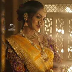 A candid moment with my beautiful Maharashtrian bride. The soft lighting and traditional window frame create a timeless portrait, showcasing her radiant smile and the complete bridal look.
