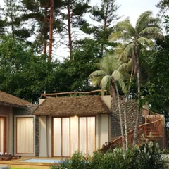 The architecture of Dev Villas in Kanha, surrounded by palm and pine trees. The use of thatched roofs and natural materials helps the buildings merge with the dense greenery.