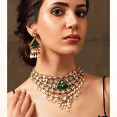 A triangular-motif necklace from the Emrosia collection, featuring large emeralds and cascading pearls for a unique bridal look.
