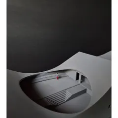 A detail of "The Arcades Project" model, showing a miniature figure within a cavernous, arched space. This helps us understand the human scale and experiential quality of our designs.