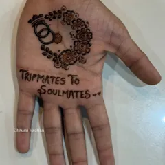 The second part of this groom's story. "Tripmates to Soulmates" is such a sweet summary of their journey, and the interlocking rings symbolize their union. It's these personal details that make groom mehendi so special.