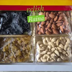 A custom dry fruit box for Diwali gifting. This one features four types of premium dry fruits: black raisins, almonds, golden raisins, and cashews, all packed fresh by me.