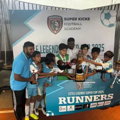 The U12 team celebrating their Runners-Up trophy at the Little Legends Super Cup. This experience, fighting in the finals, is what builds champions.