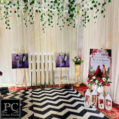 Another view of the personalized walkway, featuring the couple's photos, a custom welcome sign, and elegant lanterns, making the entrance a journey through their story.
