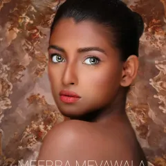 A stunning 'straight makeup' look on a dusky skin tone. The focus is on creating an even, luminous base and using warm, complementary colors to bring out a natural, radiant glow.