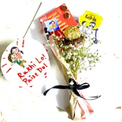 For the sibling who loves a bit of fun! This Rakhi combo features a bento cake with a playful "Rakhi Lo! Paise Do!" message and a matching chocolate bouquet.