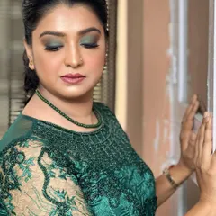 This stunning client is ready for a party with a beautiful green smokey eye that matches her embroidered dress. This look proves that smokey eyes don't always have to be black; using color adds a unique and modern twist.