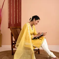 Another pose from the yellow kurta set, capturing a joyful and natural expression. We focus on creating a relaxed atmosphere to get authentic moments.